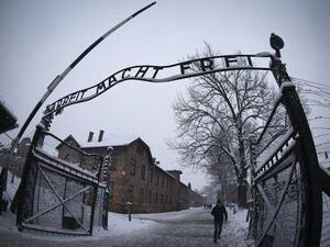 Entrance to the Nazi death camp Auschwitz-Birkenau with the lettering 'Arbeit macht (AFP/File Photo)	
