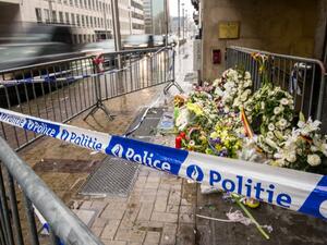 A photo taken on March 25, 2016 shows wreaths of flowers in front of an entrance of the Maalbeek subway station in Brussels in homage to the victims of Tuesday's attack.  (AFP/Philippe Huguen)