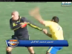 In Lebanon, a yellow card made footballers so red-faced, they gave a black eye to the now blue referee. 