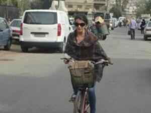 A woman bucks the establishment and rides a bike in Syria. (Syria Untold)