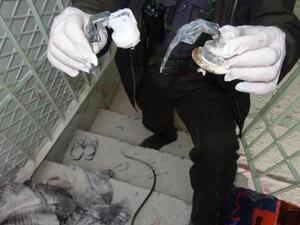 A Syrian reporter holds what he believes to be the remains of the canisters that held the poisonous gas dropped form helicopters onto the people of Saraqeb. ( image courtesy of Yalla Souriya )