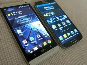 HTC One and the Samsung s4 are both slick phones but which is Arab friendly? (image courtesy of Z District)