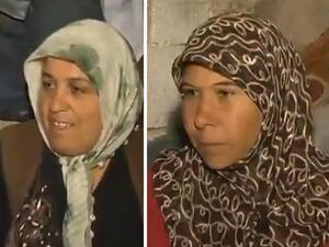 Uum Maher (left) has placed the fate of this Syrian woman and her family into her already strained hands.