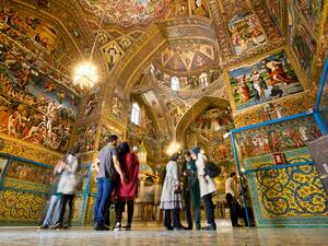 Tourists stand inside the Armenian Cathedral in Isfahan on October 15, 2014. The Cathedral, also known as the Church of the Saintly Sisters, was built in 1664. (Shutterstock)   Tourists stand inside the Armenian Cathedral in Isfahan on October 15, 2014. The Cathedral, also known as the Church of the Saintly Sisters, was built in 1664. (Shutterstock)
