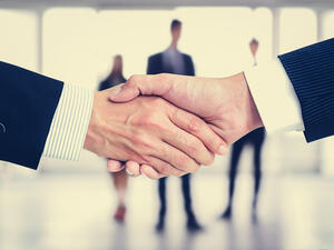 A wave of ground breaking mergers is again sweeping through the developed world and which would have significant repercussions on global economic developments. (File photo)