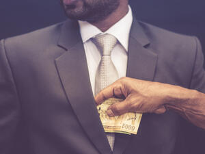 A third of people overall said they feared retaliation if they reported corruption. (Shutterstock)