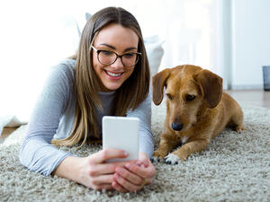 PlayDate has a built-in camera and a microphone to speak commands to your dog and you can even make this high-tech ball squeak, all from the comfort of your smartphone. (Shutterstock)
