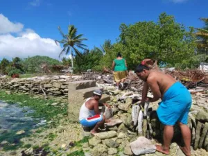 Residents of Kiribati attempt to block the rising tide with stone walls. (File)
