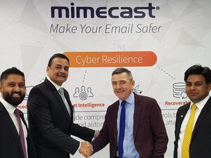 Spire Solution's Sanjeev Walia shakes hands with Mimecast's Jeff Ogden