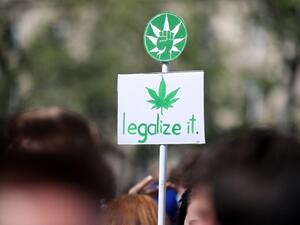 A banner picturing a cannabis leaf and reading “legalize it” during a march for cannabis and marijuana in Paris. (AFP/ File)