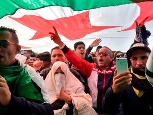 Protesters hold placards during a sit-in against the Algerian presidential bid for a fifth term in office (Twitter)