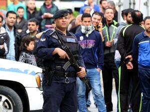 A Jordanian security forces member secures a street in the town of Irbid on March 2, 2016, following a security operation targeting a group of suspected jihadists. (AFP/Khalil Mazraawi)