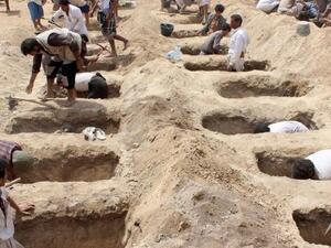 Child sized graves for the 29 victims of an airstrike on their school bus in Yemen (Twitter)