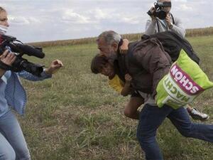 The father and son were tripped up by Petra Laszio as they tried to flee from police. (Screenshot)