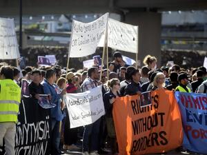 Supporters of Free Movement Group of Finland attend a demonstration at the Finnish Immigration Service headquarters in Helsinki, on September 8, 2016. The asylym seekers demonstrated against the tightened asylum policy of Finland. (AFP/Vesa Moilanen)