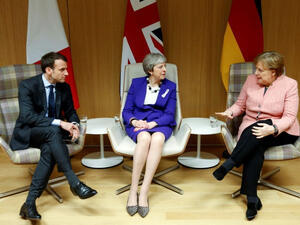 British Prime Minister Theresa May (C), German Chancellor Angela Merkel (R) and French President Emmanuel Macron. (AFP/ File Photo)