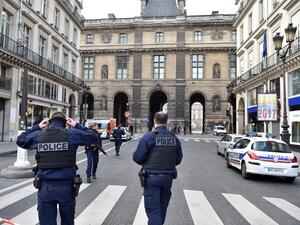 French police officers patrol near the Louvre museum on February 3, 2017 in Paris after a soldier has shot and gravely injured a man who tried to attack him. (AFP/Alain Jocard)