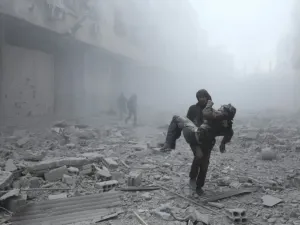 A wounded man is carried following an air strike on the rebel-held town of Erbin in Eastern Ghouta near Damascus on January 2, 2018 ABDULMONAM EASSA/AFP/FILE