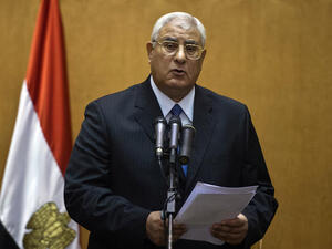 Egypt's interim President Adly Mansour addresses the nation after he was sworn in on Thursday July 4 (AFP)