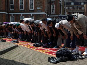 Muslims attend Friday prayers in the sunshine at the BBC Community Centre in the Spitalfields area, London, UK (Getty)