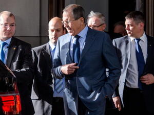 Russian Foreign Minister Sergei Lavrov leaves the Intercontinental Hotel on the third day of talks on Iran's nuclear program, on November 9, 2013 in Geneva.[AFP]