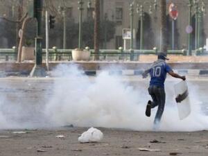 Egyptian runs through tear gas during the 2011 uprising