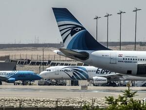 EgyptAir planes are seen on the tarmac at Cairo international airport on May 19, 2016 after an EgyptAir flight from Paris to Cairo crashed into the Mediterranean on with 66 people on board, prompting an investigation into whether it was mechanical failure or a bomb. (AFP/Khaled Desouki)