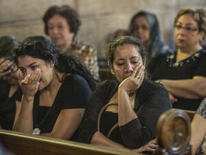 Relatives of the passengers killed in the EgyptAir crash attend a mourning service on May 22. (AFP/Khaled Desouki)