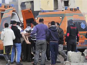 Egyptian emergency personnel move a victim into an ambulance following a car bomb explosion that targeted a police station in North Sinai’s capital of el-Arish, April 12, 2015. (AFP/File)
