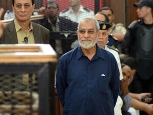 Muslim Brotherhood leader Mohamed Badie stands in front of the judges during his trial in the capital Cairo on May 18, 2014. (AFP/Ahmed Gamel)