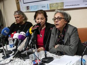 Seif el-Dawla , Suzan Fayyad, center, and Magda Adly, right, co-founder of El Nadeem Center for Rehabilitation of Victims of Violence, hold a press conference in Cairo, Sunday, Feb. 21, 2016. (AFP/Mohamad El Raai)