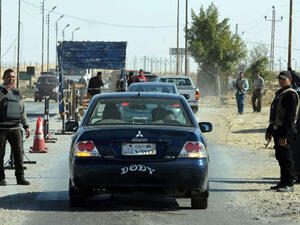 Egyptian police inspect cars at a checkpoint in North Sinai. (AFP)