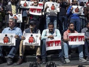Journalists and photojournalists demonstrate in Cairo against repeated attacks on members of the press in Egypt (AFP)