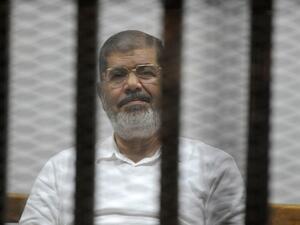 Deposed former president Mohamed Morsi in court (AFP/ File)
