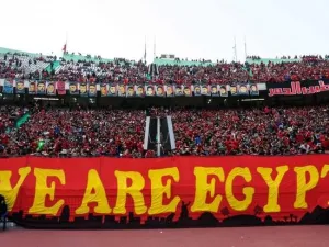 Members of the Ahlawy Ultras hold up a banner during a game (AFP/ File Photo)