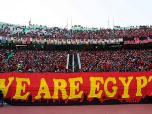Members of the Ahlawy Ultras hold up a banner during a game (AFP/ File Photo)