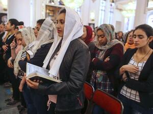 Egyptian Christians pray during the Good Friday procession at the St. George church in the town of Mohalla in the north of Egypt, on April 14, 2017. (AFP/Stringer)