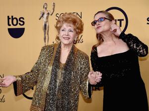 Actresses Debbie Reynolds (L), seen in 2015 with daughter actress Carrie Fisher, was rushed to hospital only one day after Fisher's death following a heart attack (AFP Photo/Ethan Miller)
