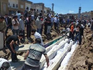 Mass burial at Houla, Syria