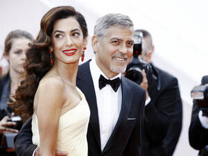 George Clooney and Amal Clooney. (Andrea Raffin / Shutterstock.com)