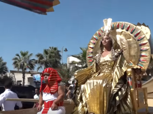 Cleopatra takes a seat. (YouTube / New China TV)