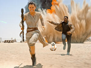 Daisy Ridley and John Boyega flee spoilers. (Walt Disney)