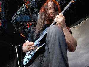 John Petrucci admires his guitar neck. (TDC Photography / Shutterstock.com)