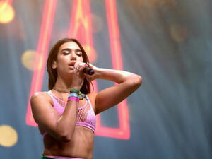 Dua Lipa has been forced to reschedule several US tour dates due to "scheduling conflicts". (Source: DFP Photographic - Shutterstock)