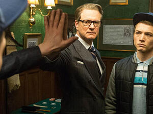 Harry Hart contemplates life as Eggsy wonders what the hell is going on. (20th Century Fox)