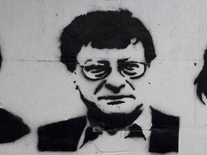Mahmoud Darwish's likeness spray-painted. (Wikimedia Commons)