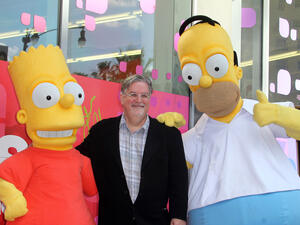 Matt Groening with Homer and Bart, notably not murdering them. (s_bukley / Shutterstock.com)