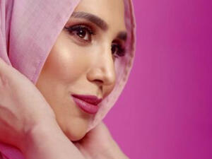 As the first woman wearing a headscarf to feature in a major mainstream hair campaign, Khan called the collaboration “game changing.” (Source: @amenaofficial - Instagram)