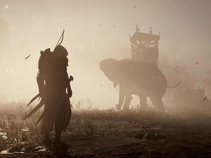 Bayek stares at the war elephants. (Ubisoft)