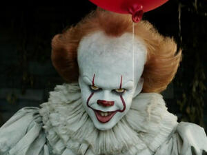 Throw cash at him and maybe he'll stop murdering everyone. (Warner Bros. Pictures)